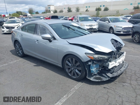 2018 Mazda 6 Grand Touring with VIN JM1GL1TY0J1306768, listed as a IAAI auction lot 41744640 with 81,798 mi miles and . Bid and sale history available at DreamBid. Image 1.