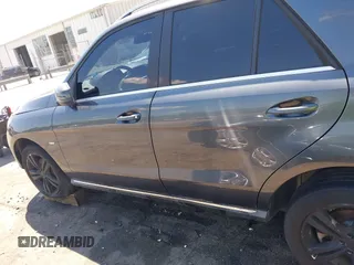 2012 Mercedes-Benz M ML 350 with VIN 4JGDA5HB6CA075264, listed as a IAAI auction lot 42059330 with 147,642 mi miles. Bid and sale history available at carsss.com. Image 14.