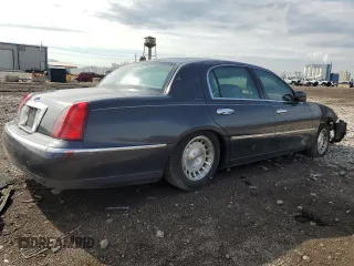 1999 Lincoln Town Car Executive z VIN 1LNHM81W0XY644873, wystawiony jako Copart lot #52865095 z przebiegiem Nie podano mil oraz Szkoda całkowita • Salvage title. Historia ofert i sprzedaży dostępna na DreamBid. Obrazek 3.