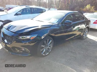 2018 Mazda 6 Grand Touring with VIN JM1GL1TY0J1319083, listed as a IAAI auction lot 40852818 with 57,408 mi miles and . Bid and sale history available at DreamBid. Image 2.