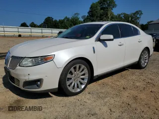2011 Lincoln MKS EcoBoost with VIN 1LNHL9FTXBG608128, listed as a Copart auction lot 61526995 with 119,600 mi miles and Salvage title. Bid and sale history available at DreamBid. Image 1.
