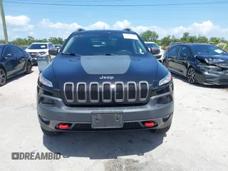 2017 Jeep Cherokee Trailhawk with VIN 1C4PJMBS9HW537962, listed as a IAAI auction lot 42002460 with 129,037 mi miles and . Bid and sale history available at DreamBid. Image 13.