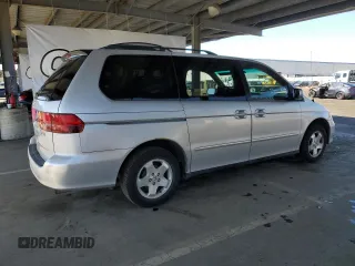 2001 Honda Odyssey EX z VIN 2HKRL18601H559033, wystawiony jako Copart lot #57119025 z przebiegiem 333 068 mil mil oraz Szkoda całkowita • Salvage title. Historia ofert i sprzedaży dostępna na DreamBid. Obrazek 3.