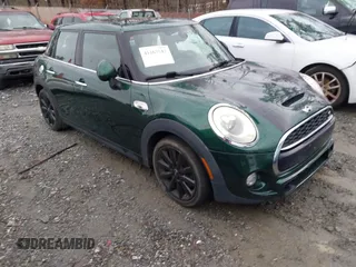 2016 MINI Cooper Hardtop 4 Door S with VIN WMWXU3C58G2D31595, listed as a IAAI auction lot 41267547 with 145,191 mi miles. Bid and sale history available at carsss.com. Image 1.