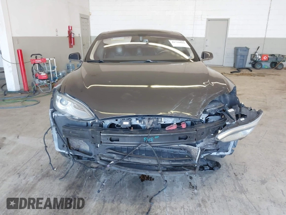 2014 Tesla Model S 60 with VIN 5YJSA1H13EFP49912, listed as a IAAI auction lot 41716661 with 129,776 mi miles and . Bid and sale history available at DreamBid. Image 13.