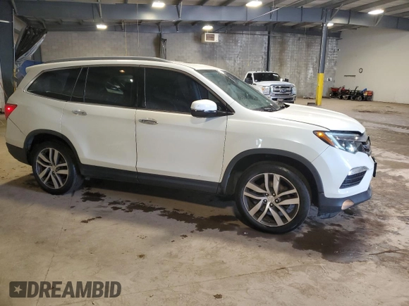 2017 Honda Pilot Elite with VIN 5FNYF6H08HB005758, listed as a Copart auction lot 53655725 with 124,218 mi miles and Salvage Title. Bid and sale history available at DreamBid. Image 4.