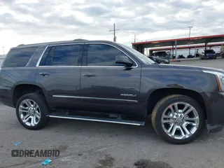 2017 GMC Yukon Denali with VIN 1GKS1CKJ0HR153941, listed as a IAAI auction lot 41300648 with 128,193 mi miles. Bid and sale history available at carsss.com. Image 13.