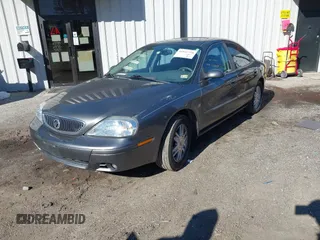 2004 Mercury Sable LS Premium z VIN 1MEHM55S54G607845, wystawiony jako IAAI lot #41812758 z przebiegiem 200 883 mil mil oraz . Historia ofert i sprzedaży dostępna na DreamBid. Obrazek 17.