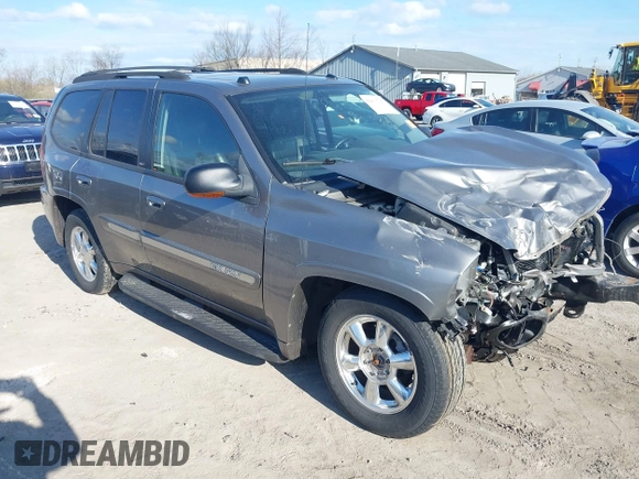2005 GMC Envoy SLE with VIN 1GKDT13S852362380, listed as a IAAI auction lot 42031727 with 76,711 mi miles. Bid and sale history available at carsss.com. Image 6.