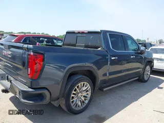 2019 GMC Sierra 1500 Denali z VIN 1GTU9FEL5KZ387012, wystawiony jako IAAI lot #42002743 z przebiegiem 124 718 mil mil oraz . Historia ofert i sprzedaży dostępna na DreamBid. Obrazek 4.