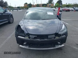 2023 Tesla Model 3 with VIN 5YJ3E1EA4PF410060, listed as a IAAI auction lot 42067624 with 59,934 mi miles and . Bid and sale history available at DreamBid. Image 12.