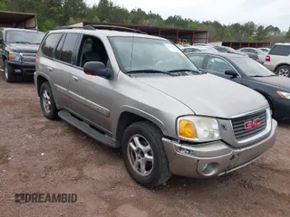2003 GMC Envoy SLT with VIN 1GKDS13S332186712, listed as a IAAI auction lot 41876922 with 158,609 mi miles. Bid and sale history available at carsss.com. Image 1.