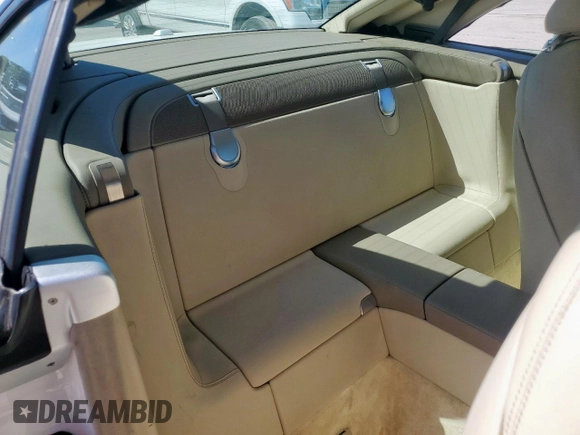 2009 Mercedes-Benz SL 550 with VIN WDBSK71F69F147589, listed as a Copart auction lot 65976995 with 77,387 mi miles and Salvage title. Bid and sale history available at DreamBid. Image 10.