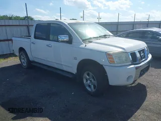 2004 Nissan Titan LE with VIN 1N6AA07A04N561241, listed as a IAAI auction lot 42180597 with 166,529 mi miles. Bid and sale history available at carsss.com. Image 1.