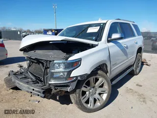 2016 Chevrolet Tahoe LTZ with VIN 1GNSKCKCXGR341155, listed as a IAAI auction lot 41244868 with 163,455 mi miles. Bid and sale history available at carsss.com. Image 2.