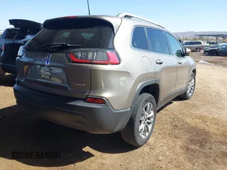 2021 Jeep Cherokee Altitude with VIN 1C4PJLLBXMD155096, listed as a IAAI auction lot 41746319 with 99,423 mi miles and . Bid and sale history available at DreamBid. Image 4.