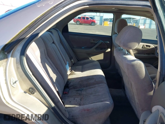 1998 Toyota Camry LE z VIN JT2BG22K3W0151088, wystawiony jako IAAI lot #41429977 z przebiegiem 435 394 mil mil oraz . Historia ofert i sprzedaży dostępna na DreamBid. Obrazek 8.