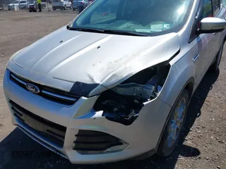 2016 Ford Escape Titanium with VIN 1FMCU9JX6GUB80715, listed as a IAAI auction lot 42060305 with 132,951 mi miles and . Bid and sale history available at DreamBid. Image 6.