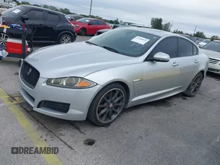 2015 Jaguar XF V6 Portfolio with VIN SAJWA0F79F8U77985, listed as a IAAI auction lot 41386030 with 81,335 mi miles. Bid and sale history available at carsss.com. Image 2.