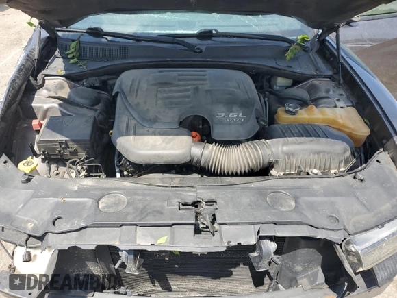 2013 Dodge Charger SE z VIN 2C3CDXBG5DH638254, wystawiony jako Copart lot #58925295 z przebiegiem 201 802 mil mil oraz Szkoda całkowita • Salvage title. Historia ofert i sprzedaży dostępna na DreamBid. Obrazek 11.