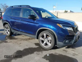 2020 Honda Passport Touring with VIN 5FNYF7H90LB004665, listed as a IAAI auction lot 41669821 with 59,768 mi miles and . Bid and sale history available at DreamBid. Image 1.