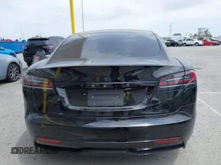 2023 Tesla Model S with VIN 5YJSA1E52PF528795, listed as a IAAI auction lot 42110660 with 21,243 mi miles and . Bid and sale history available at DreamBid. Image 16.