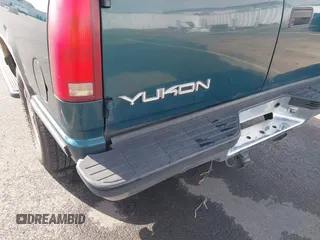 1999 GMC Yukon with VIN 1GKEK13R3XJ717999, listed as a IAAI auction lot 41870187 with 179,855 mi miles. Bid and sale history available at carsss.com. Image 6.