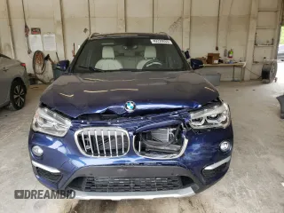 2018 BMW X1 xDrive28i with VIN WBXHT3C30J3H33429, listed as a Copart auction lot 49220033 with 28,916 mi miles. Bid and sale history available at carsss.com. Image 5.