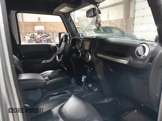 2014 Jeep Wrangler Unlimited Sahara with VIN 1C4BJWEG5EL164350, listed as a IAAI auction lot 42018586 with 113,222 mi miles. Bid and sale history available at carsss.com. Image 5.