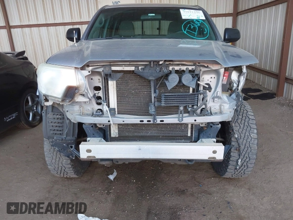 2014 Toyota Tacoma with VIN 3TMLU4EN3EM162738, listed as a IAAI auction lot 41871226 with 135,318 mi miles and . Bid and sale history available at DreamBid. Image 6.