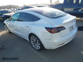 2018 Tesla Model 3 Long Range Battery with VIN 5YJ3E1EA6JF042844, listed as a IAAI auction lot 41349172 with 122,851 mi miles. Bid and sale history available at carsss.com. Image 3.