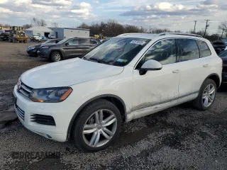 2012 Volkswagen Touareg Sport z VIN WVGFK9BP6CD002427, wystawiony jako Copart lot #42576335 z przebiegiem 167 936 mil mil oraz Szkoda całkowita • Salvage title. Historia ofert i sprzedaży dostępna na DreamBid. Obrazek 1.