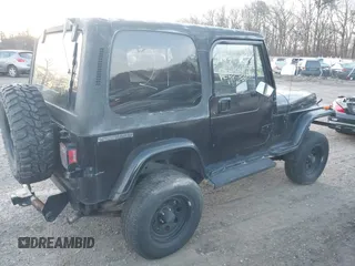 1990 Jeep Wrangler with VIN 2J4FY29T2LJ543655, listed as a IAAI auction lot 41766772 with 999,999 mi miles. Bid and sale history available at carsss.com. Image 4.
