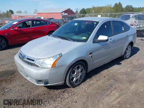 2008 Ford Focus SE with VIN 1FAHP35N48W243314, listed as a IAAI auction lot 42001321 with 210,639 mi miles. Bid and sale history available at carsss.com. Image 2.