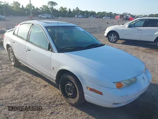 2002 Saturn SL z VIN 1G8ZF52872Z258630, wystawiony jako IAAI lot #42136196 z przebiegiem 205 914 mil mil oraz . Historia ofert i sprzedaży dostępna na DreamBid. Obrazek 1.