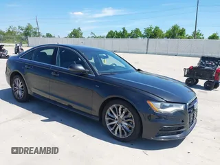 2014 Audi A6 Prestige with VIN WAUHMAFC8EN081609, listed as a IAAI auction lot 42252900 with 170,222 mi miles and . Bid and sale history available at DreamBid. Image 1.