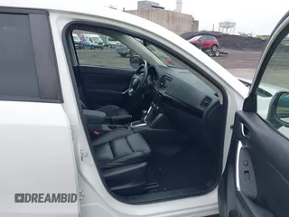 2015 Mazda CX-5 Grand Touring with VIN JM3KE4DY5F0530854, listed as a IAAI auction lot 42274582 with 144,732 mi miles and . Bid and sale history available at DreamBid. Image 5.