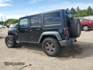 2011 Jeep Wrangler Unlimited Rubicon with VIN 1J4BA6H16BL561658, listed as a Copart auction lot 58379755 with 103,587 mi miles and Salvage title. Bid and sale history available at DreamBid. Image 2.