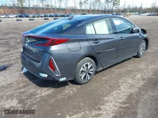 2018 Toyota Prius Prime Plus with VIN JTDKARFP3J3096141, listed as a IAAI auction lot 41822905 with 61,159 mi miles. Bid and sale history available at carsss.com. Image 4.