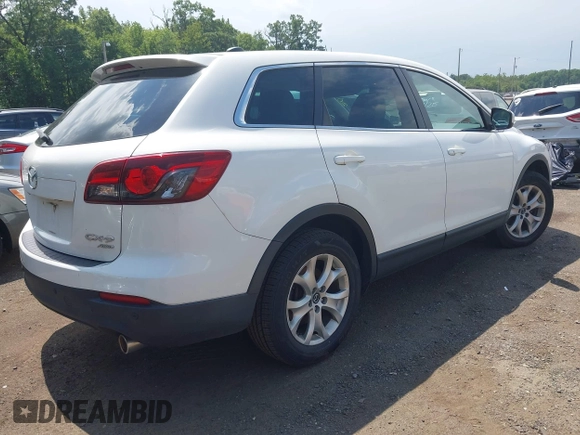 2014 Mazda CX-9 Touring z VIN JM3TB3CV7E0426900, wystawiony jako IAAI lot #42796725 z przebiegiem Nie podano mil oraz . Historia ofert i sprzedaży dostępna na DreamBid. Obrazek 4.