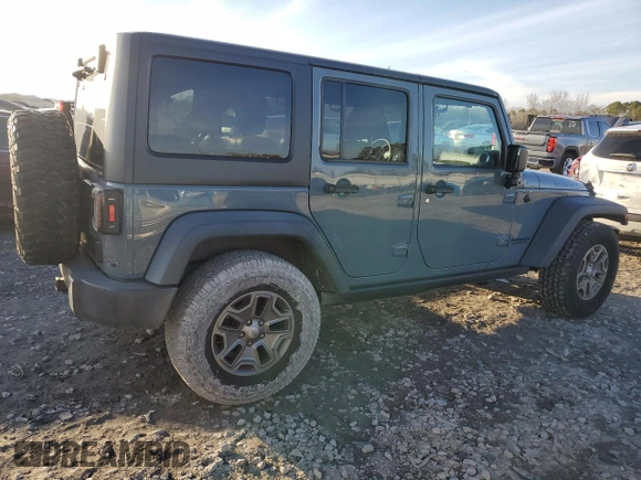2015 Jeep Wrangler Unlimited Rubicon with VIN 1C4BJWFG7FL732694, listed as a Copart auction lot 42977435 with 128,759 mi miles and Salvage Title. Bid and sale history available at carsss.com. Image 3.
