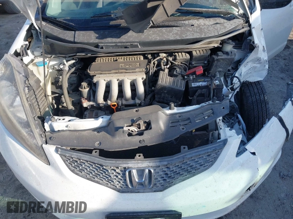 2009 Honda Fit z VIN JHMGE88249S067463, wystawiony jako IAAI lot #41354698 z przebiegiem 153 402 mil mil oraz . Historia ofert i sprzedaży dostępna na DreamBid. Obrazek 10.