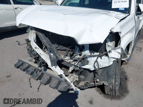 2018 Toyota Tacoma SR5 with VIN 5TFAZ5CN4JX056465, listed as a IAAI auction lot 41767848 with 71,532 mi miles and . Bid and sale history available at DreamBid. Image 18.