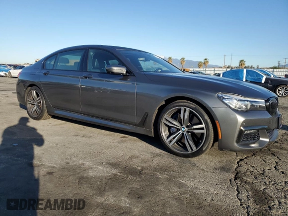2017 BMW 7 Series 740i with VIN WBA7E2C32HG740988, listed as a Copart auction lot 49613465 with 63,646 mi miles and Salvage Title. Bid and sale history available at carsss.com. Image 4.