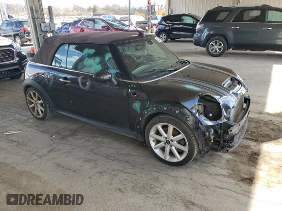 2014 MINI Convertible S with VIN WMWZP3C55ET706573, listed as a Copart auction lot 52325705 with 125,076 mi miles and Salvage Title. Bid and sale history available at DreamBid. Image 4.