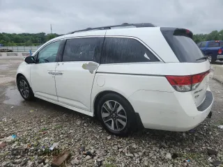 2014 Honda Odyssey Touring with VIN 5FNRL5H95EB083772, listed as a Copart auction lot 56713525 with 215,833 mi miles and Salvage title. Bid and sale history available at DreamBid. Image 2.