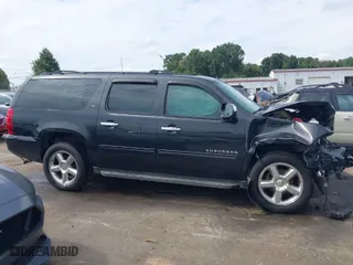2013 Chevrolet Suburban LT with VIN 1GNSCJE05DR120061, listed as a IAAI auction lot 40496570 with 232,121 mi miles. Bid and sale history available at carsss.com. Image 14.