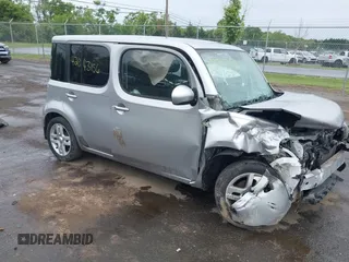 2009 Nissan Cube SL z VIN JN8AZ28R79T121729, wystawiony jako IAAI lot #42343156 z przebiegiem 111 378 mil mil oraz . Historia ofert i sprzedaży dostępna na DreamBid. Obrazek 1.