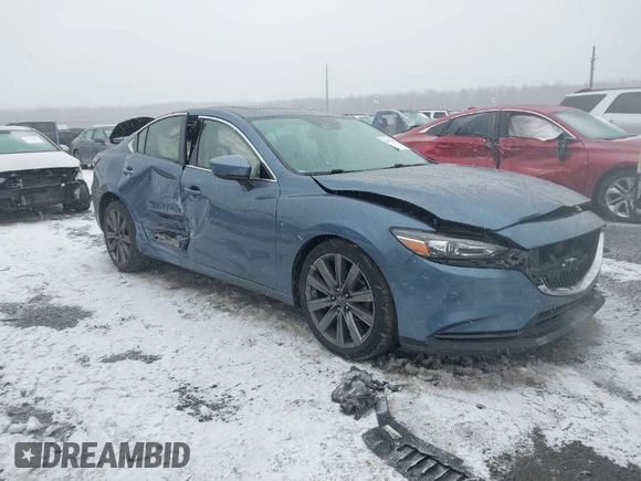 2018 Mazda 6 Grand Touring with VIN JM1GL1TY5J1330614, listed as a IAAI auction lot 41354444 with 100,744 mi miles and . Bid and sale history available at DreamBid. Image 1.