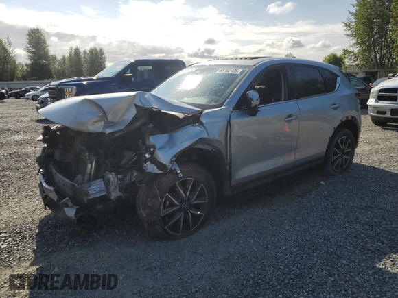 2018 Mazda CX-5 Grand Touring с VIN JM3KFBDM5J0323923, выставлен на аукционе Copart как лот 58162435 с пробегом 144 792 миль миль и Списание • Salvage title. История ставок и продаж доступна на DreamBid. Изображение 1.